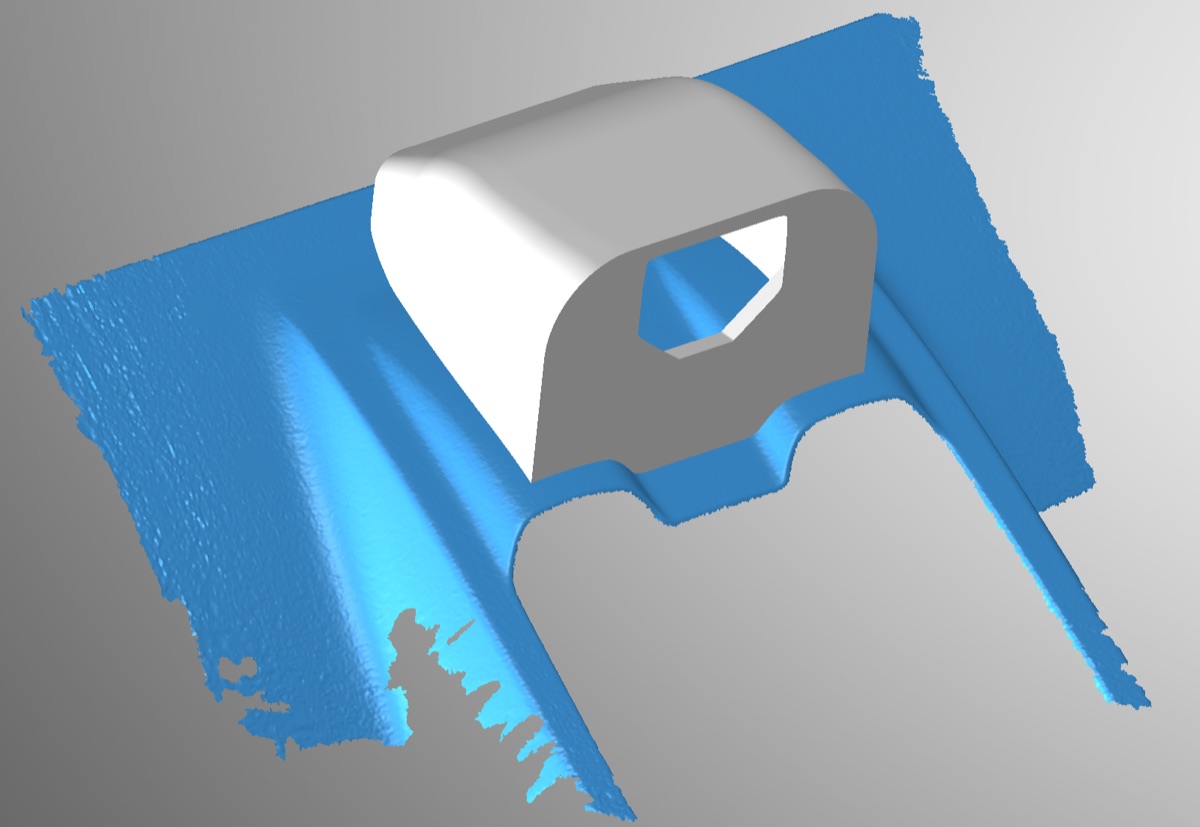 The housing designed directly against 3D scan data of the rear deck lid, not approximations.